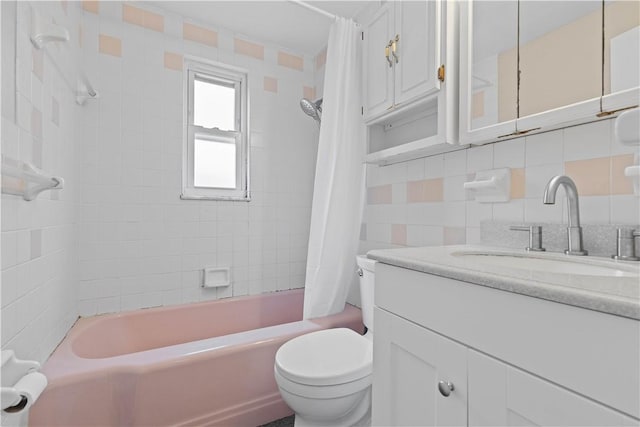 10 Ronald St, West Elizabeth, PA 15088 - full bathroom with vanity, shower / bath combo with shower curtain, backsplash, and tile walls