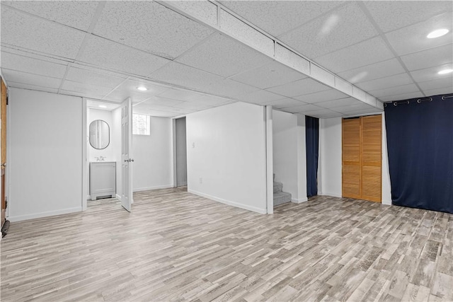 10 Ronald St, West Elizabeth, PA 15088 - below grade area featuring light wood-style flooring, a paneled ceiling, stairway, and recessed lighting