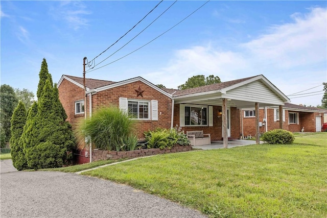 10 Ronald St, West Elizabeth, PA 15088 - ranch-style house with brick siding, a front yard, and covered porch