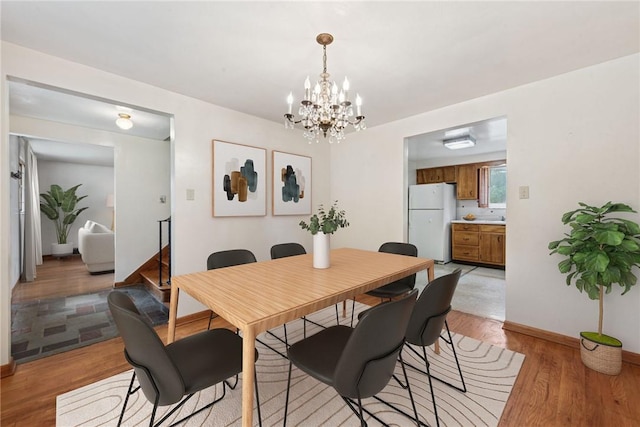 1920 Cheryl Dr, North Huntingdon, PA 15642 - dining area featuring light wood-style floors and a chandelier