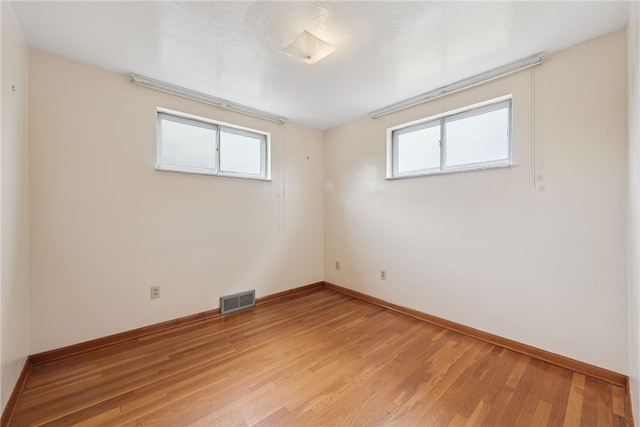 1920 Cheryl Dr, North Huntingdon, PA 15642 - empty room with healthy amount of natural light and light wood finished floors
