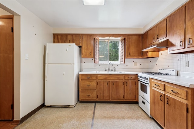 1920 Cheryl Dr, North Huntingdon, PA 15642 - kitchen featuring white appliances, under cabinet range hood, and brown cabinets