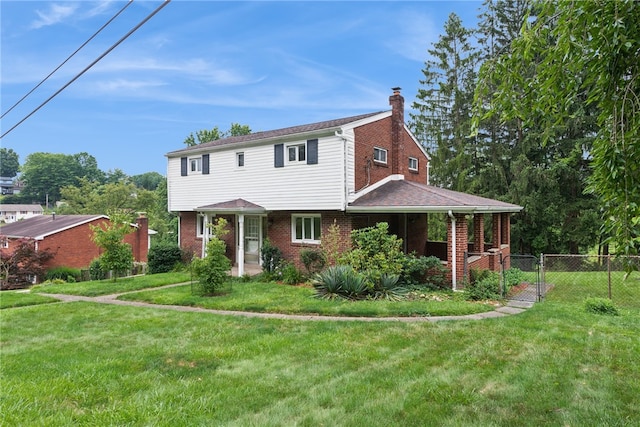 1920 Cheryl Dr, North Huntingdon, PA 15642 - colonial inspired home featuring a chimney and brick siding
