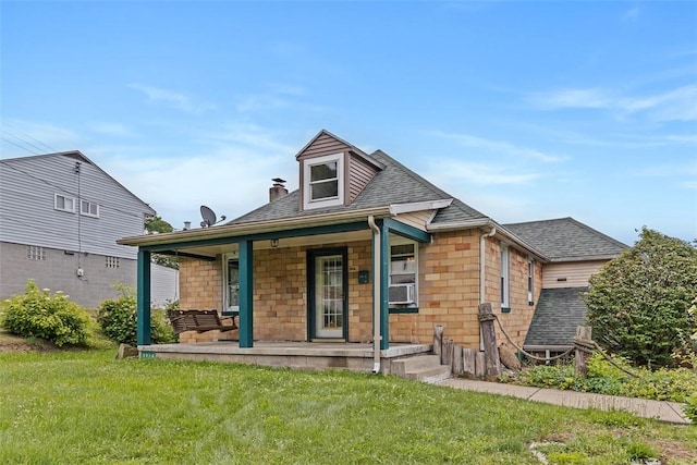 3914 38th St, Pulaski Twp, PA 15066 - back of house featuring covered porch, a lawn, and roof with shingles
