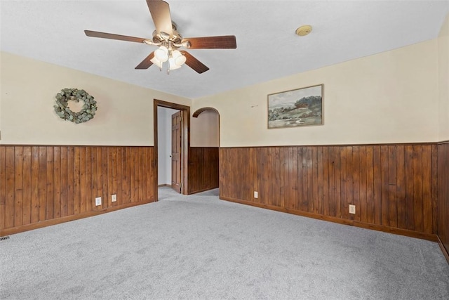 3914 38th St, Pulaski Twp, PA 15066 - spare room with a wainscoted wall, ceiling fan, a smoke detector, light carpet, and wood walls