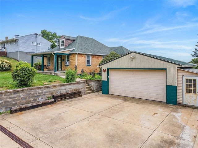 3914 38th St, Pulaski Twp, PA 15066 - view of front of home with a porch, a detached garage, roof with shingles, and an outdoor structure