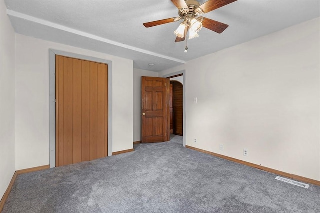 3914 38th St, Pulaski Twp, PA 15066 - unfurnished bedroom featuring carpet floors, ceiling fan, arched walkways, and a closet