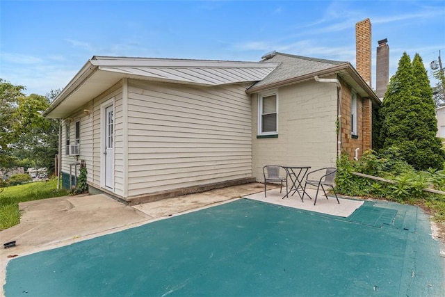 3914 38th St, Pulaski Twp, PA 15066 - rear view of property featuring a patio area, a chimney, and cooling unit