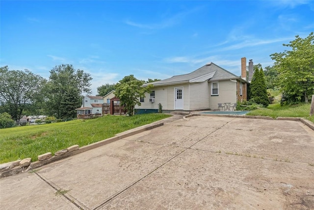 3914 38th St, Pulaski Twp, PA 15066 - view of side of home with a chimney, a yard, and a patio