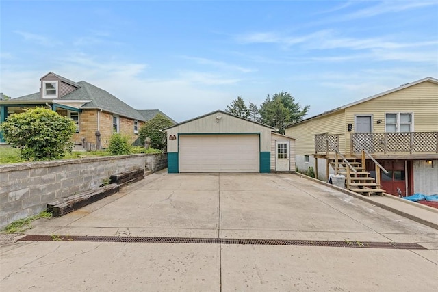 3914 38th St, Pulaski Twp, PA 15066 - view of side of property featuring a garage, an outbuilding, stairway, and a deck