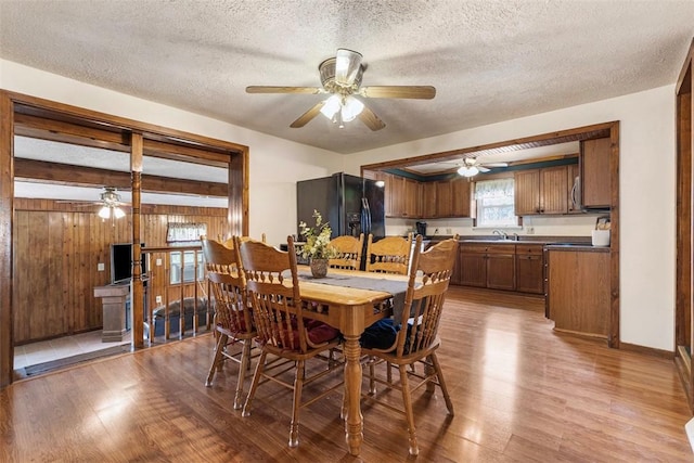 3914 38th St, Pulaski Twp, PA 15066 - dining space with a ceiling fan, wood finished floors, and a textured ceiling