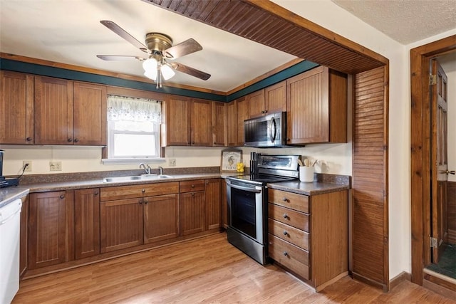 3914 38th St, Pulaski Twp, PA 15066 - kitchen featuring stainless steel appliances, dark countertops, and brown cabinets