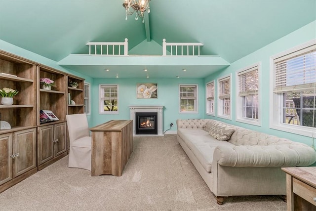 115 Nursery Rd, Forward Twp, PA 16053 - living area with light colored carpet, a glass covered fireplace, beam ceiling, and high vaulted ceiling
