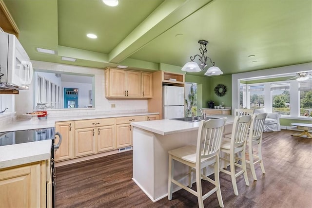 115 Nursery Rd, Forward Twp, PA 16053 - kitchen with white appliances, light brown cabinets, dark wood-style flooring, a kitchen bar, and recessed lighting