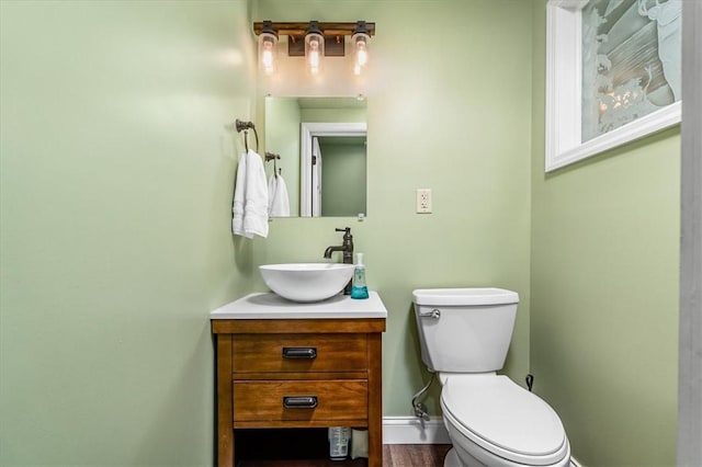 115 Nursery Rd, Forward Twp, PA 16053 - half bath featuring vanity and wood finished floors
