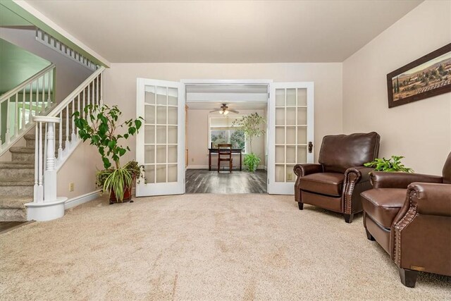 115 Nursery Rd, Forward Twp, PA 16053 - living area with french doors, carpet flooring, stairway, and a ceiling fan