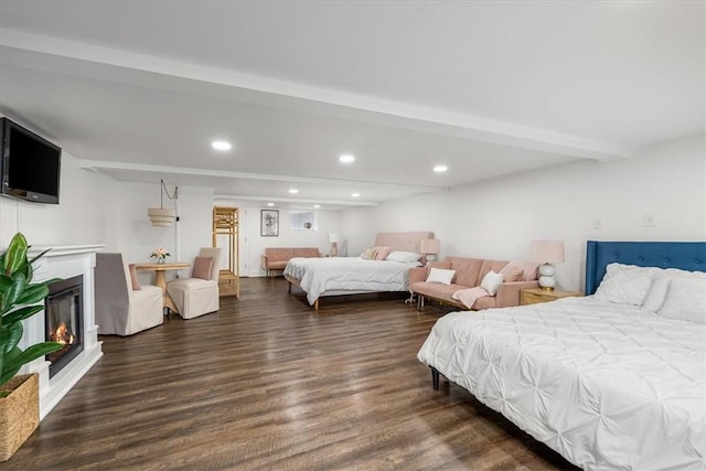 115 Nursery Rd, Forward Twp, PA 16053 - bedroom with wood finished floors, recessed lighting, a glass covered fireplace, and beam ceiling
