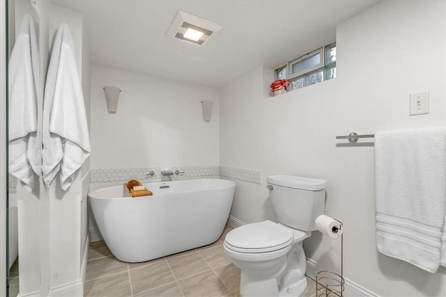 115 Nursery Rd, Forward Twp, PA 16053 - full bath featuring a freestanding bath and tile patterned flooring