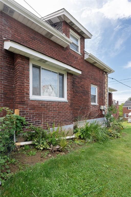 2913 Willett Rd, Brentwood, PA 15227 - view of home's exterior with brick siding and a lawn