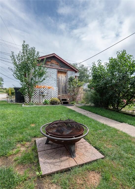 2913 Willett Rd, Brentwood, PA 15227 - view of green lawn with a fire pit