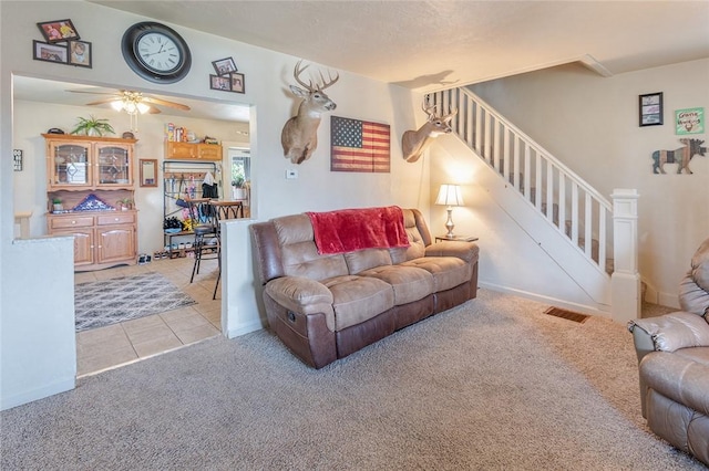 2913 Willett Rd, Brentwood, PA 15227 - living room featuring carpet flooring, stairs, ceiling fan, and tile patterned floors