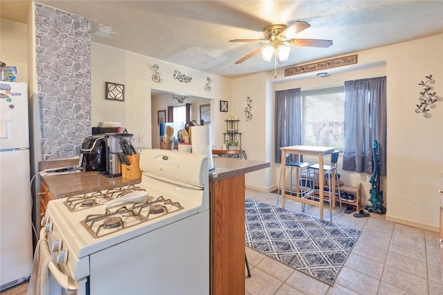 2913 Willett Rd, Brentwood, PA 15227 - kitchen featuring white appliances, a ceiling fan, and light tile patterned floors