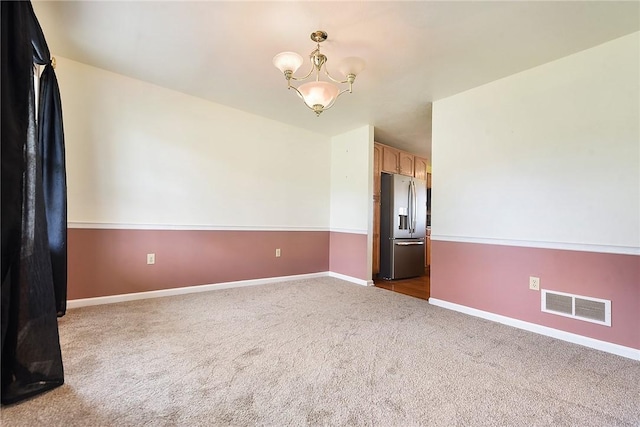 538 Bluegrass Dr, Canonsburg, PA 15317 - unfurnished room with a chandelier and dark colored carpet