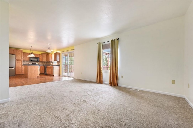 538 Bluegrass Dr, Canonsburg, PA 15317 - unfurnished living room with light carpet and baseboards