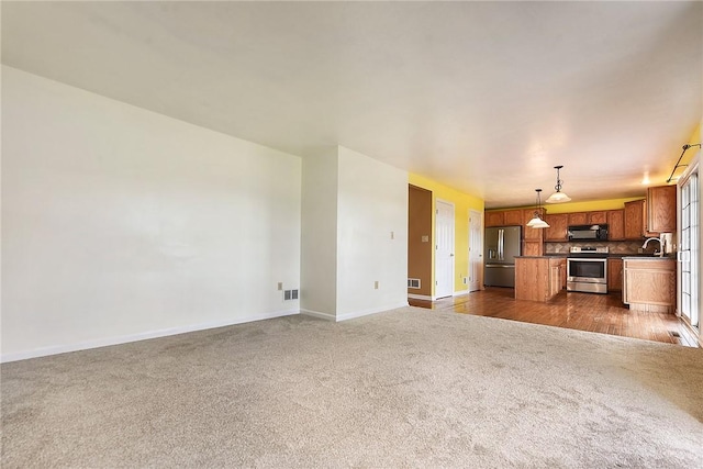 538 Bluegrass Dr, Canonsburg, PA 15317 - unfurnished living room with dark carpet and baseboards