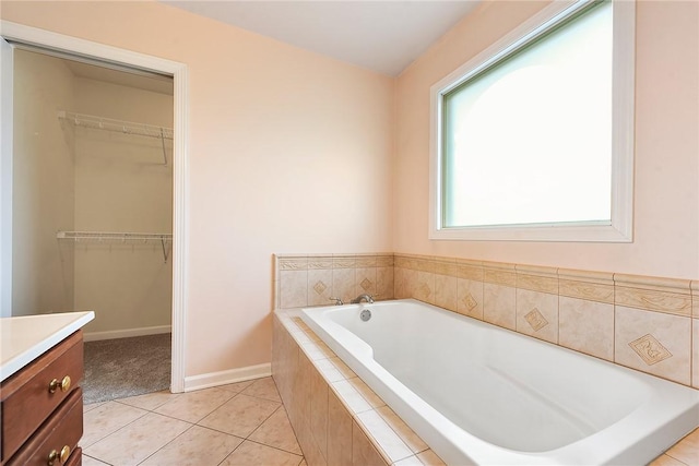 538 Bluegrass Dr, Canonsburg, PA 15317 - bathroom with vanity, a garden tub, tile patterned floors, and a walk in closet