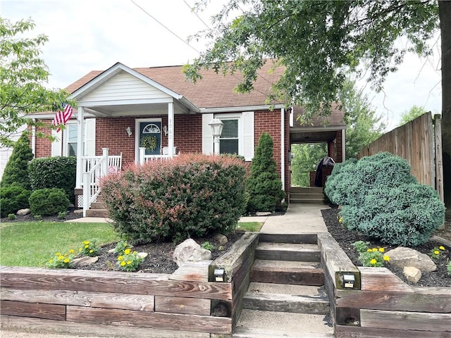 1069 Martin Ave, New Kensington, PA 15068 - view of front of home featuring brick siding, covered porch, and stairs