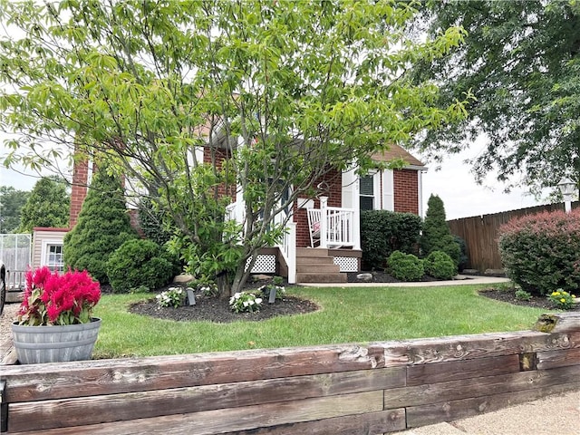 1069 Martin Ave, New Kensington, PA 15068 - view of property hidden behind natural elements featuring brick siding and a deck