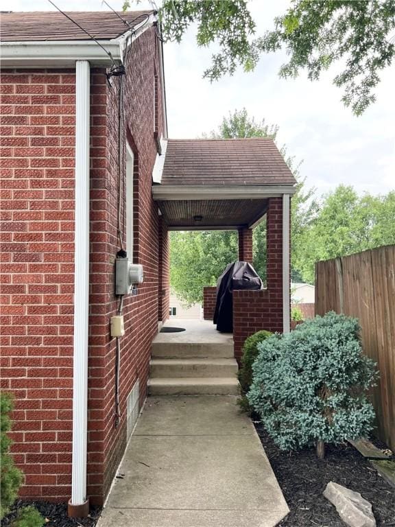 1069 Martin Ave, New Kensington, PA 15068 - view of side of home featuring brick siding and a shingled roof