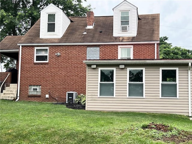 1069 Martin Ave, New Kensington, PA 15068 - rear view of property featuring a yard and brick siding