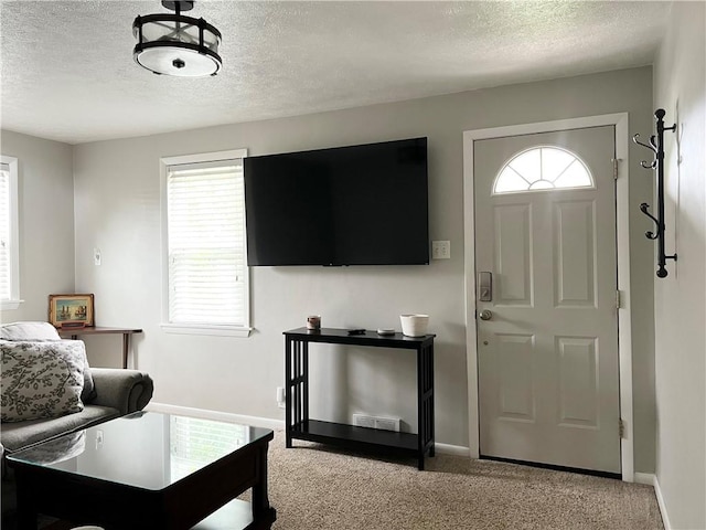 1069 Martin Ave, New Kensington, PA 15068 - living room with a textured ceiling, plenty of natural light, and light colored carpet