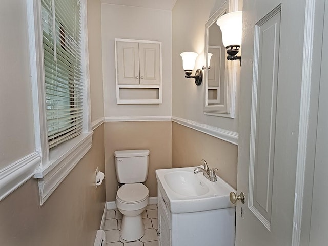 881 Ridge Rd, Harmony Twp, PA 15003 - bathroom with a baseboard heating unit, vanity, and tile patterned flooring