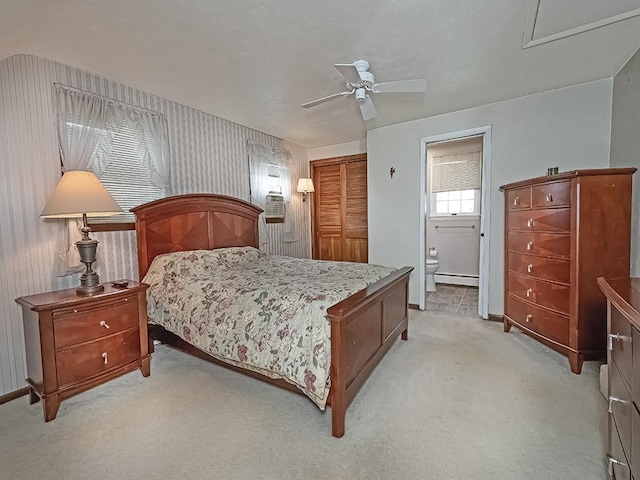 881 Ridge Rd, Harmony Twp, PA 15003 - bedroom with light carpet, a closet, connected bathroom, ceiling fan, and baseboard heating
