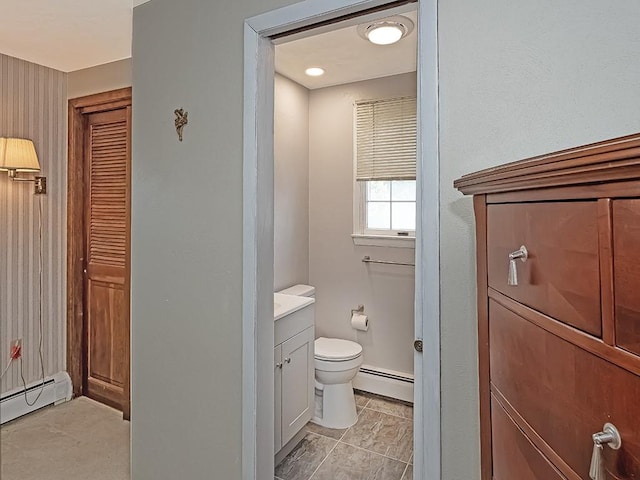 881 Ridge Rd, Harmony Twp, PA 15003 - bathroom featuring a baseboard radiator, vanity, and a closet