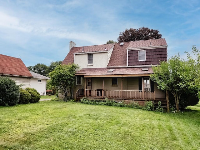 881 Ridge Rd, Harmony Twp, PA 15003 - rear view of property featuring a chimney, a yard, a porch, and roof with shingles