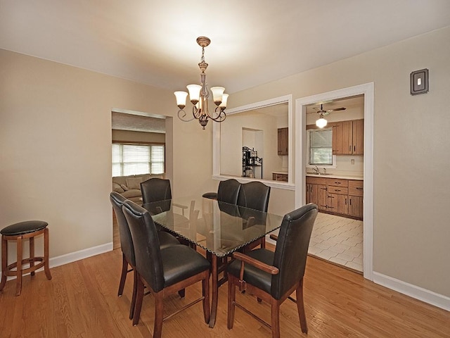 881 Ridge Rd, Harmony Twp, PA 15003 - dining room featuring a chandelier and light wood-style floors
