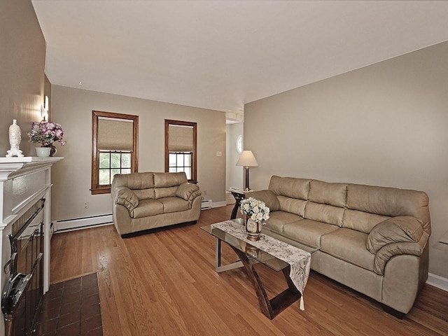 881 Ridge Rd, Harmony Twp, PA 15003 - living room featuring baseboard heating, dark wood-style flooring, and a fireplace with flush hearth