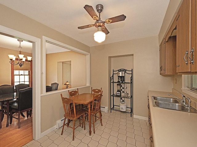 881 Ridge Rd, Harmony Twp, PA 15003 - dining room with a chandelier, a ceiling fan, and a baseboard heating unit