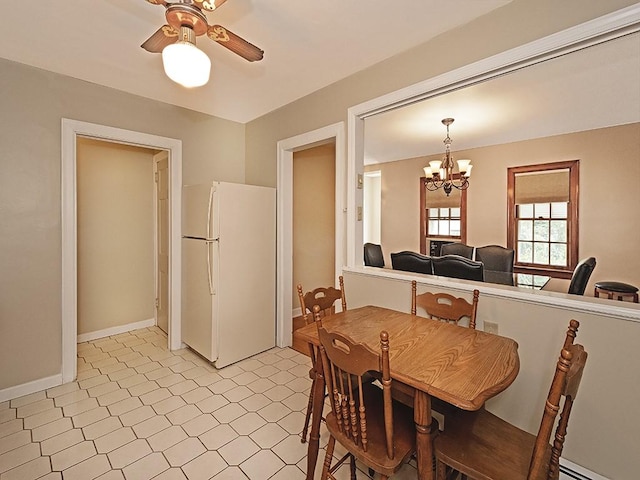 881 Ridge Rd, Harmony Twp, PA 15003 - dining area featuring a chandelier, ceiling fan, and a baseboard heating unit