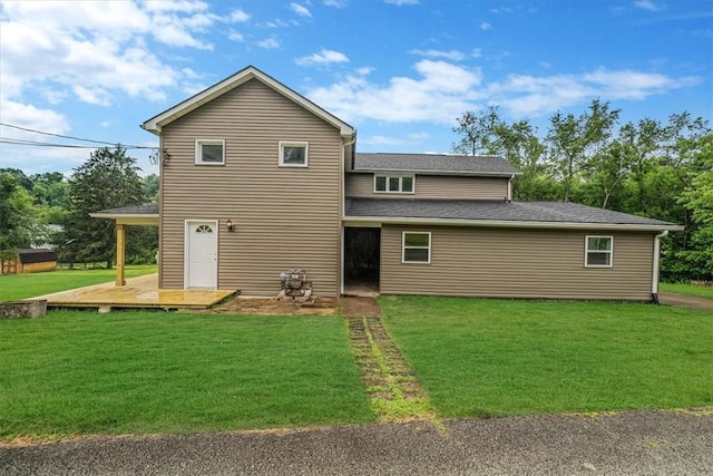 7321 Ringertown Rd, Murrysville, PA 15632 - rear view of house featuring a yard and a shingled roof