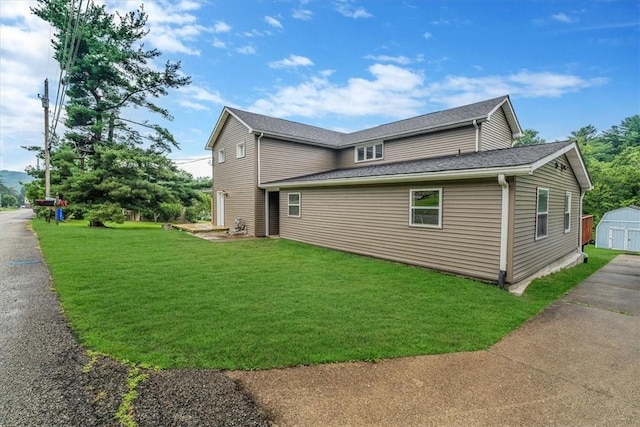 7321 Ringertown Rd, Murrysville, PA 15632 - view of side of home featuring a storage shed and a lawn