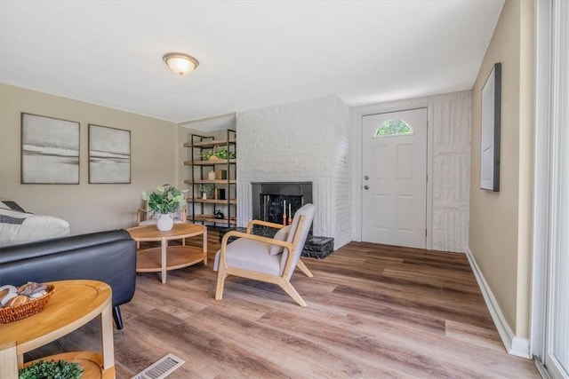 7321 Ringertown Rd, Murrysville, PA 15632 - living room featuring light wood-style floors and a fireplace