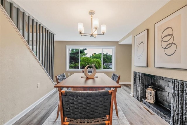 7321 Ringertown Rd, Murrysville, PA 15632 - dining space featuring a chandelier and light wood-style flooring