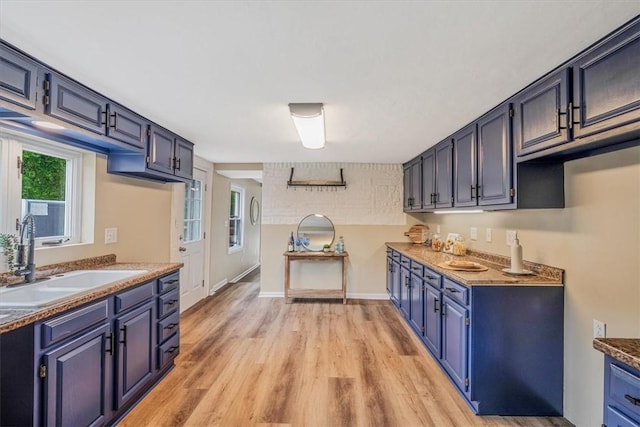 7321 Ringertown Rd, Murrysville, PA 15632 - kitchen with light wood-style flooring and blue cabinets