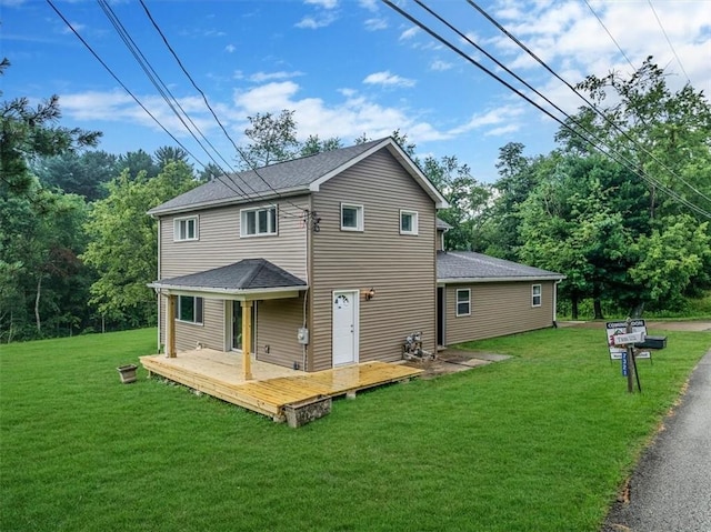 7321 Ringertown Rd, Murrysville, PA 15632 - back of house with a yard, a deck, and roof with shingles