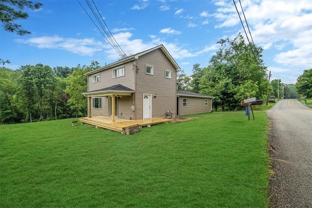 7321 Ringertown Rd, Murrysville, PA 15632 - back of property featuring a lawn and a deck
